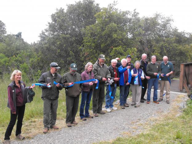POST and Midpen staff perform the official ribbon-cutting before the guided hike. Hannah Moore photo.