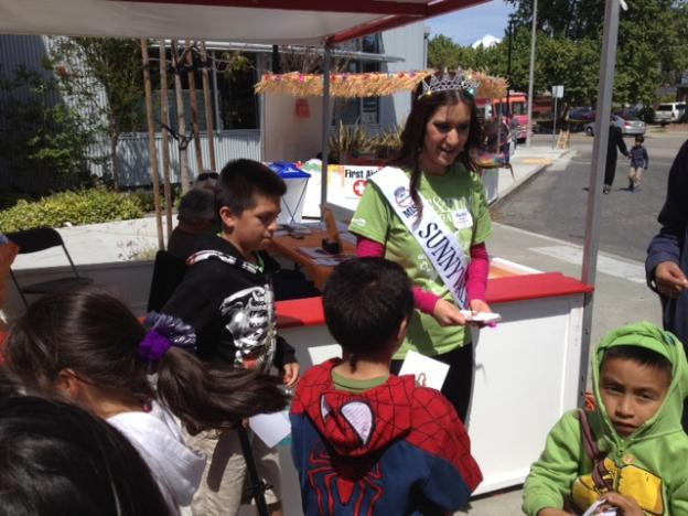 Rachel Sanville, Miss Sunnyvale, signed photos for her fans. 