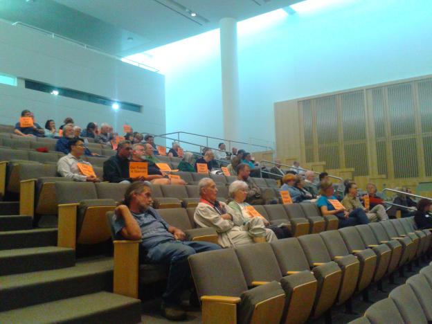 “Old Can Be Strong” and “Value Our History” were among the many signs held by community advocates during Tuesday’s city council meeting. Hannah Moore photo.