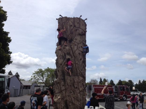  Three girls conquer the Climb On Rock Wall, which was crawling with kids all day long.
