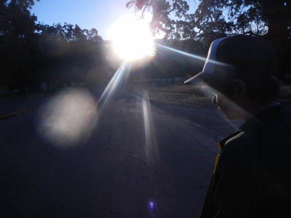 Jackson Masters watches the solstice sun rise through the Avenue of the Sun.